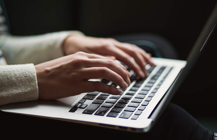 Woman typing on computer