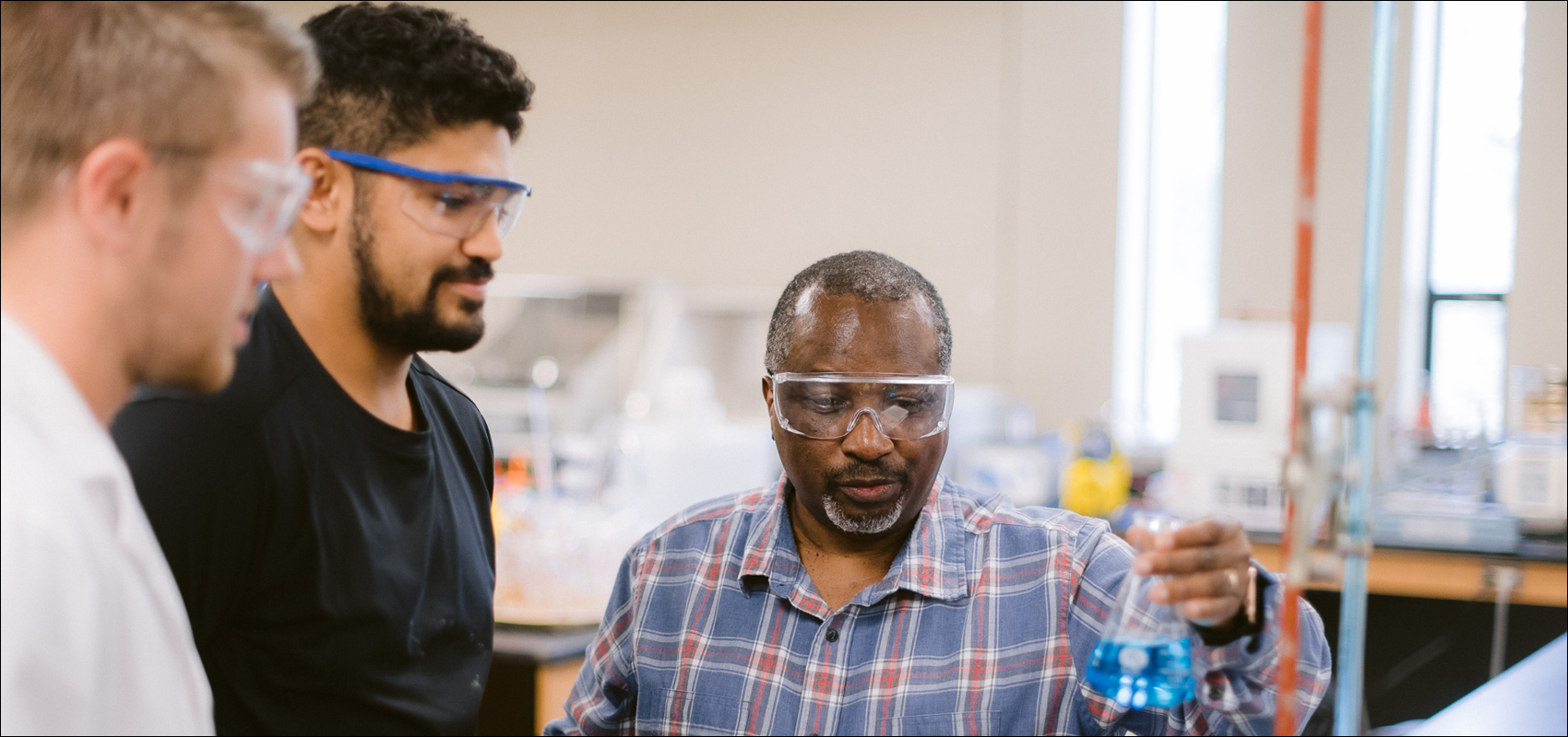 three men in chemistry lab